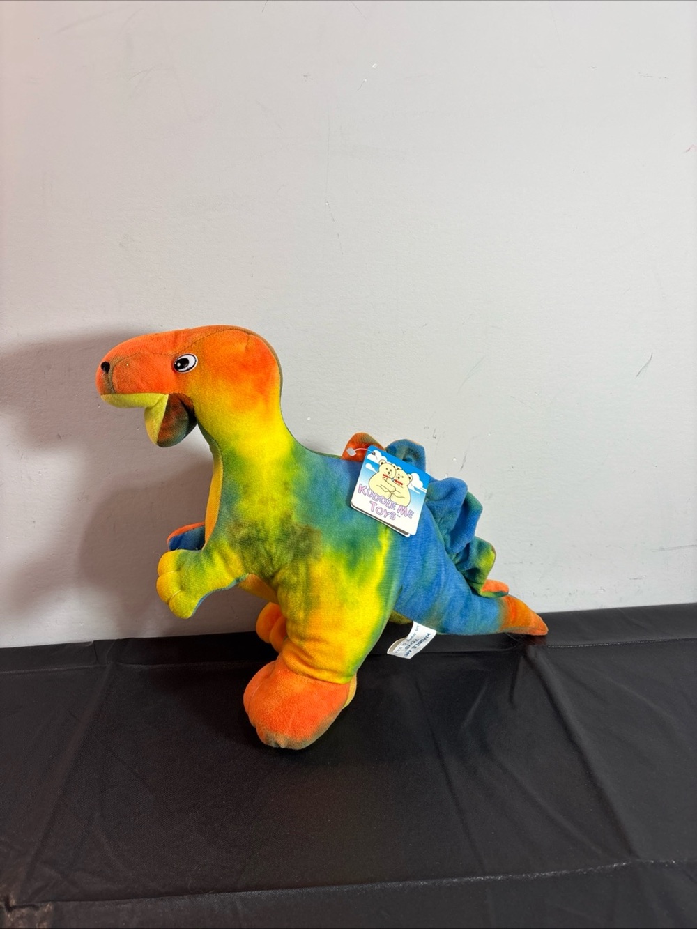 Kuddle Me Toys Tie-Dye Plush Dinosaur Toy - Multicolor Stuffed Animal. 9/18